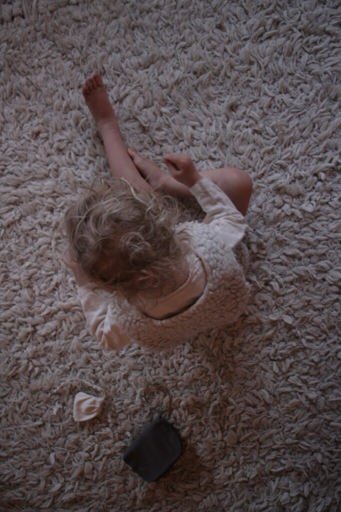Child playing on the carpet